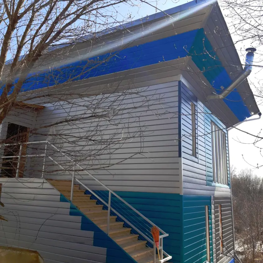 Фото 2 дома Перевертыш металлосайдинг Евро-Брус под брус в ассортименте